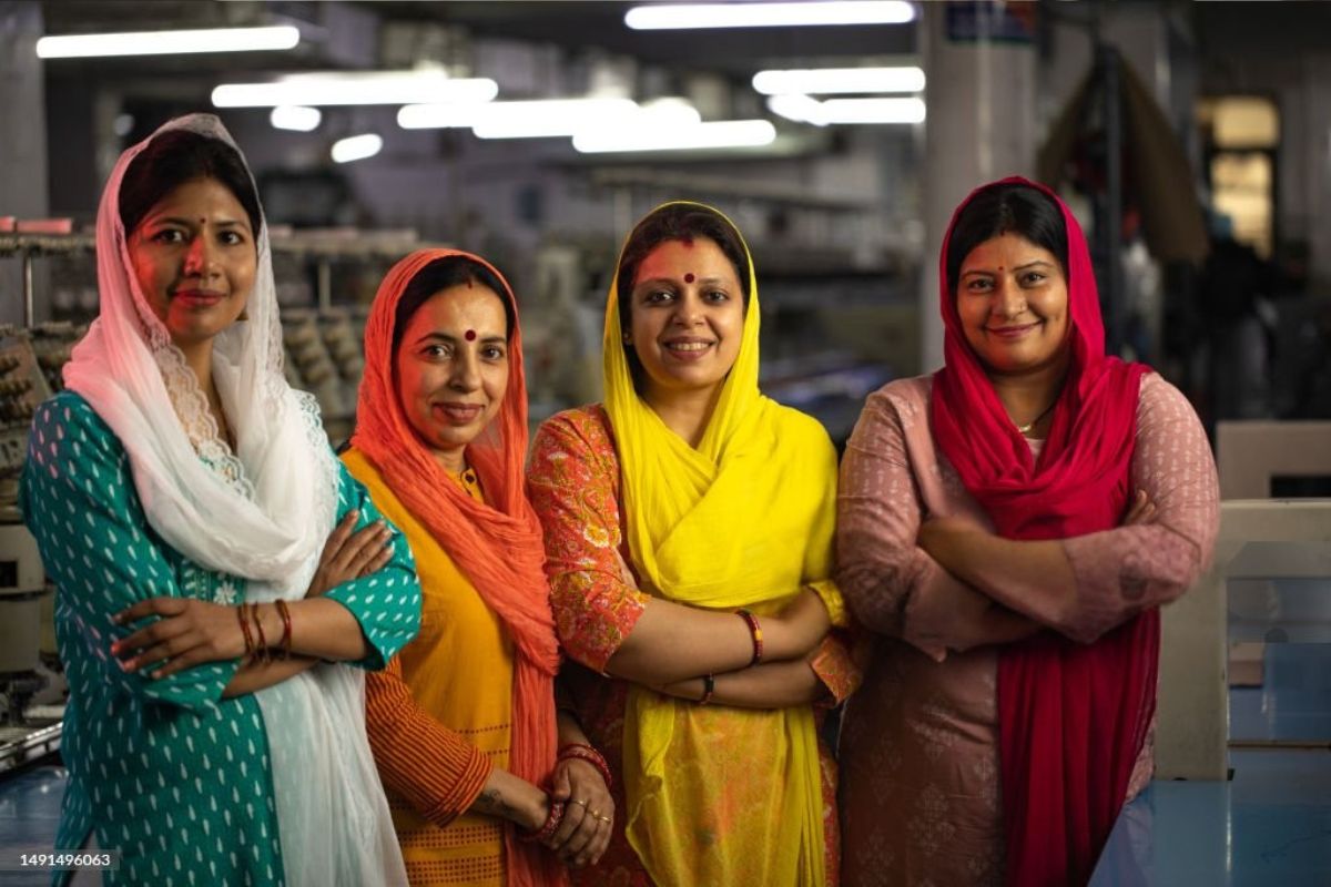 Four rural women smiling